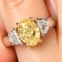 GIA 3.02cts Fancy Yellow Oval Diamond Platinum Three Stone Engagement Ring