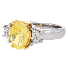 3.02cts Fancy Yellow Oval Diamond Platinum Three Stone Engagement Ring